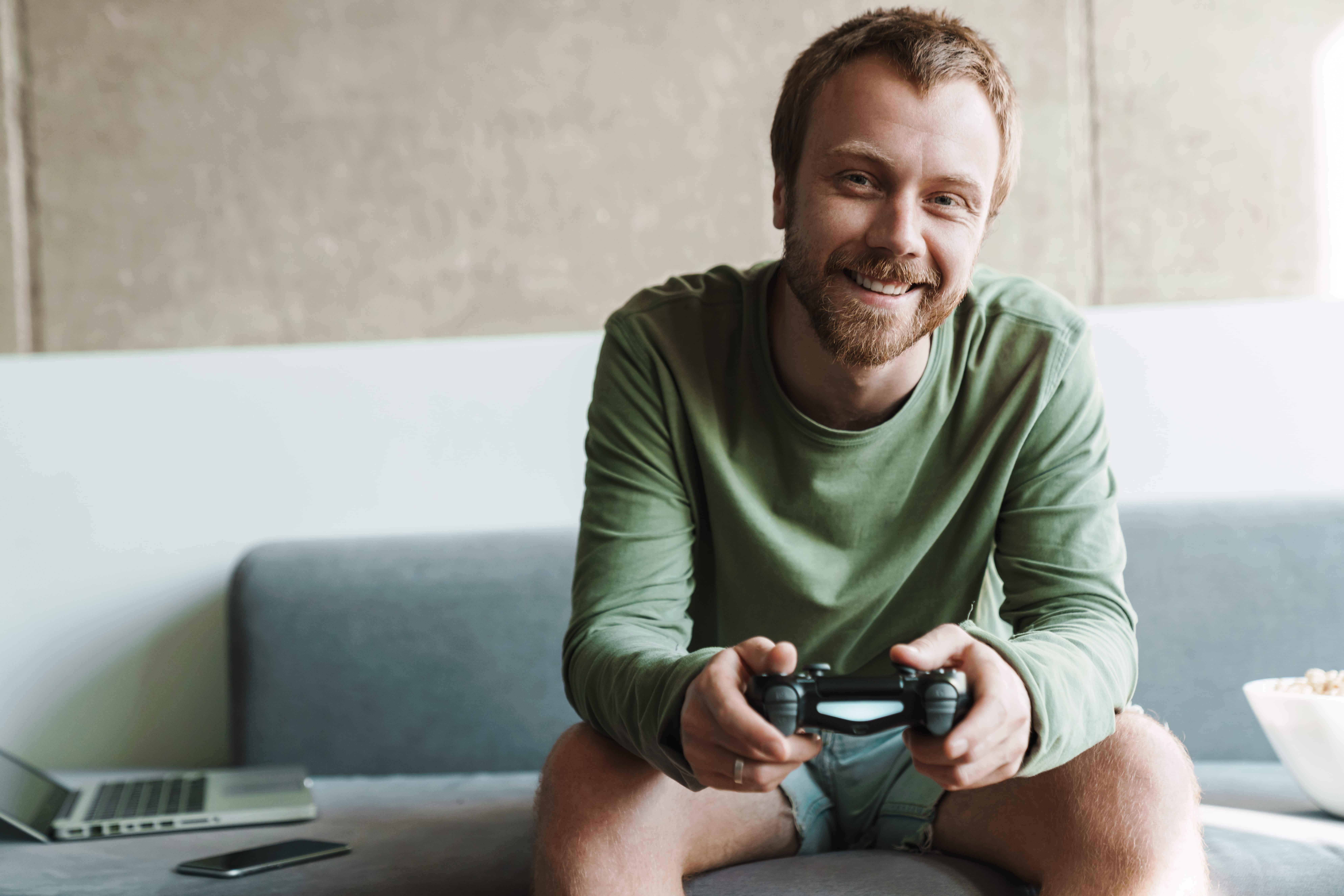 Man gaming looking happy